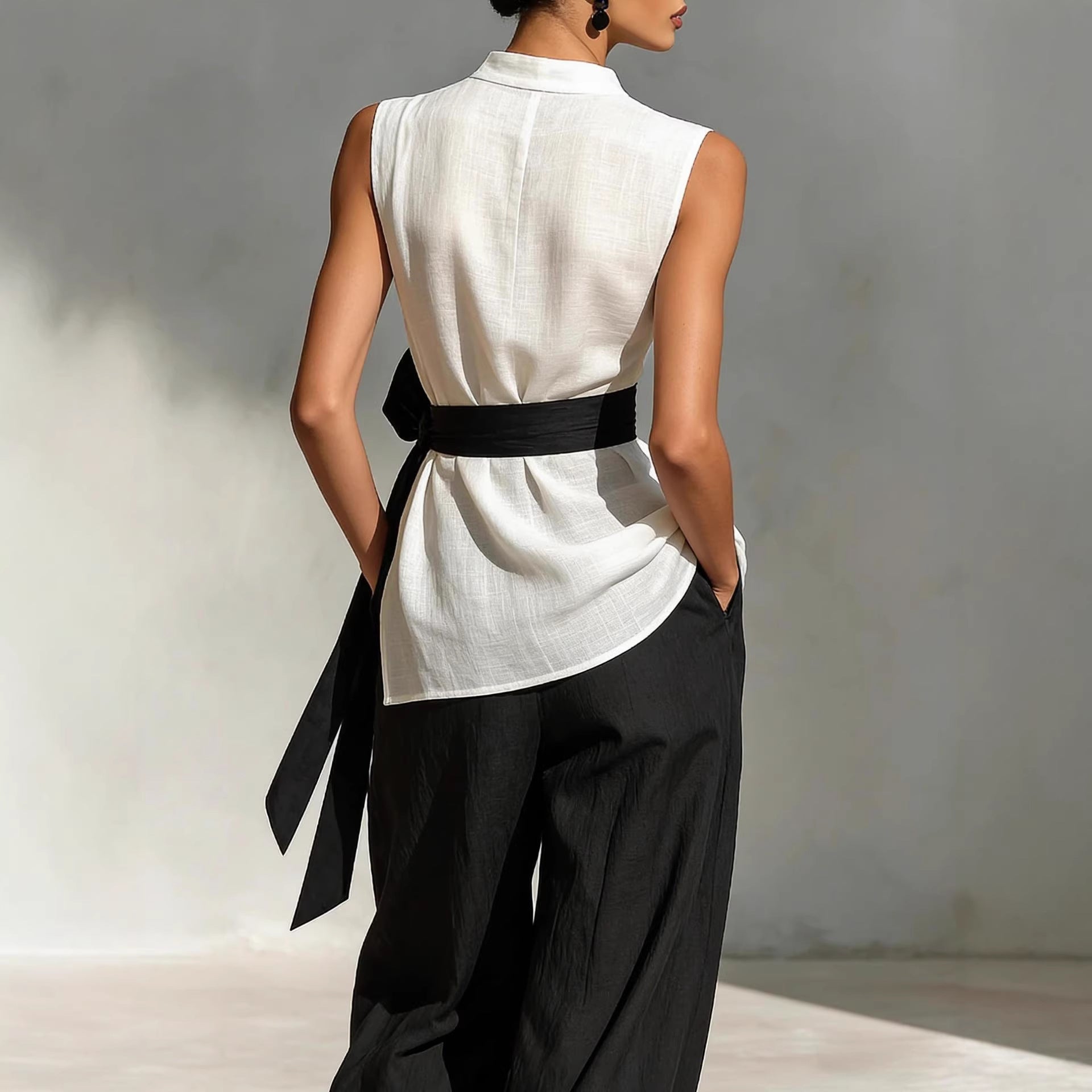 Two piece set of lace up sleeveless top and wide leg pants 